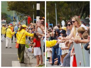 Практикувальники Фалуньгун роздають глядачам параду інформаційні матеріали про Фалуньгун, практику вдосконалення душі та тіла